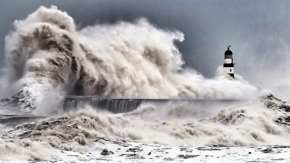 Seaham lighthouse in County Durham being bombarded by huge waves